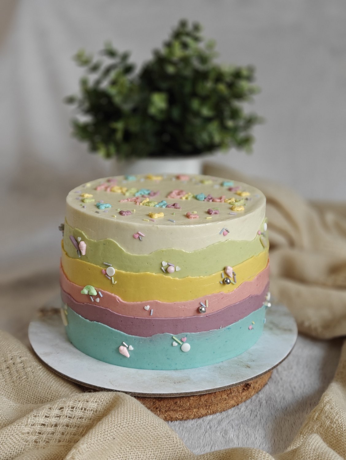 Pastel rainbow layered birthday cake